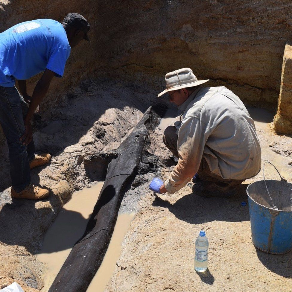 Archaeologists dig at the site in Zambia