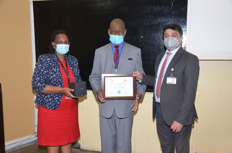 Dr Joad Bodo (centre) on August 27, 2021, during a ceremony to mark his retirement from the Aga Khan University Hospital Medical School, where he had been a section head for 17 years.