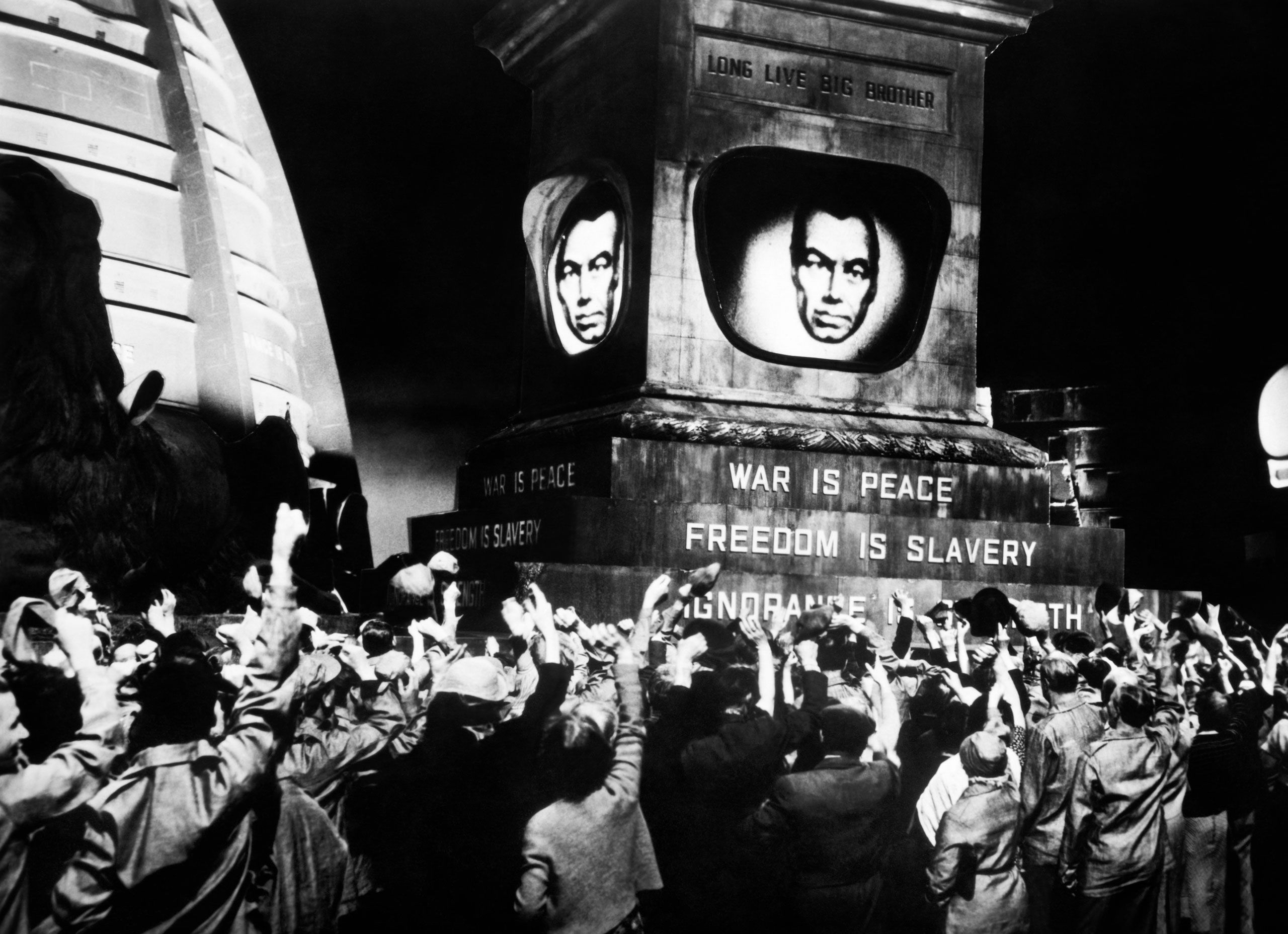 Still from 1984 with text War is Peace. Freedom is Slavery