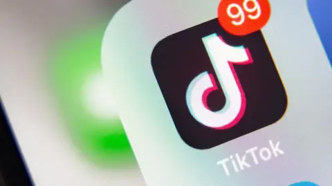 Getty Images Close-up of symbol for TikTok app on a phone screen