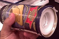 Can with button in white plastic base