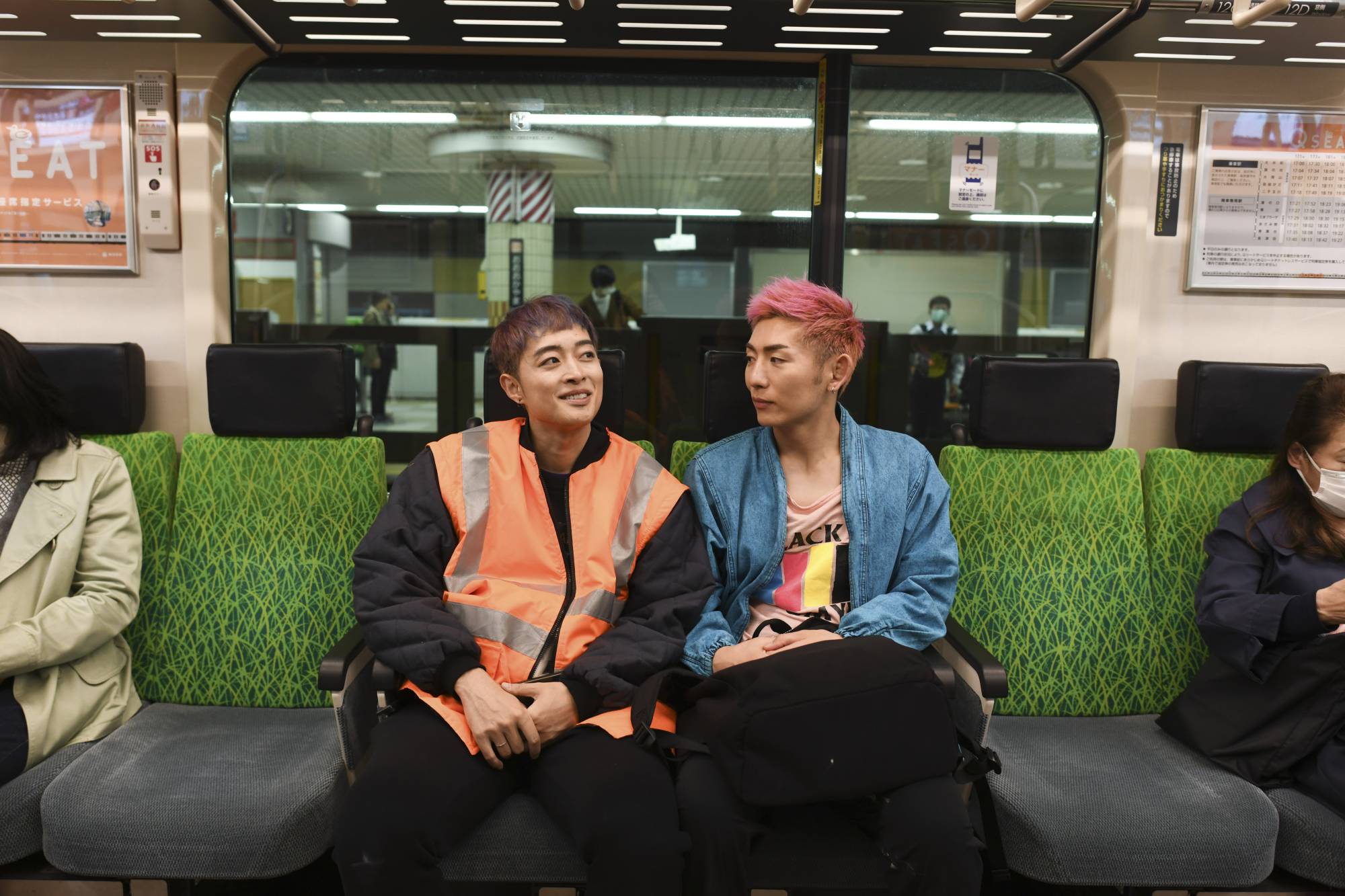 Kohei Katsuyama and his longtime partner, Kaneshige Hirata take the subway in Tokyo. | NORIKO HAYASHI / THE NEW YORK TIMES