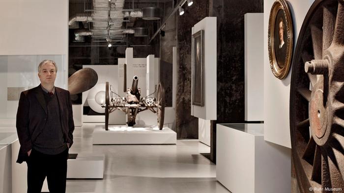 Museum Director Theodor Grütter standing in the exhibition hall