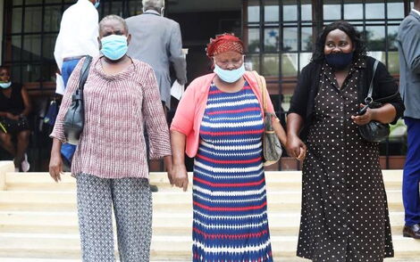Mombasa Widow Katharina Welele (centers) with colleagues at Mombasa Law Courts