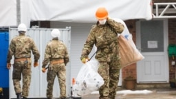 U.K. military personnel at the house of former Russian spy Sergei Skripal in Salisbury, England, on February 4, 2019