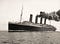 A black and white photo of the HMS Lusitania