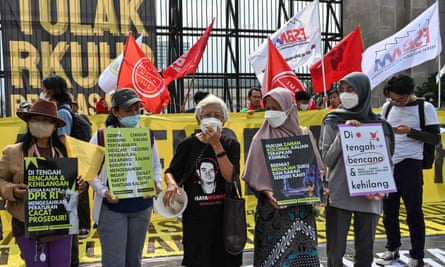 Activists protesting against the new criminal code outside the parliament building in Jakarta