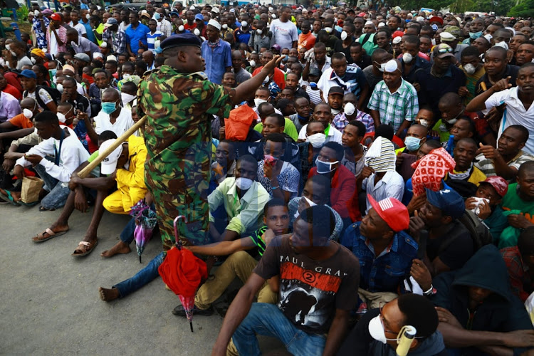 Mombasa residents rounded up before the start of the curfew on March 27, 2020.