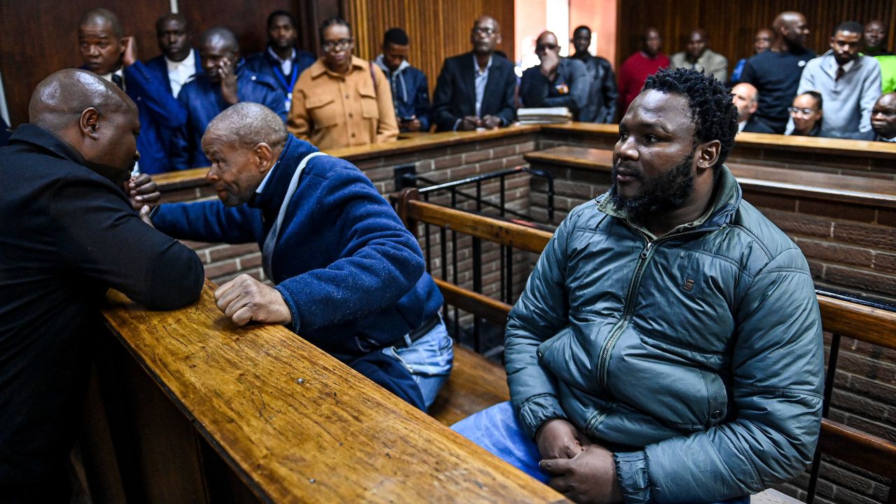 Magudumana's 65-year-old father Zolile Cornelius Sekeleni and former prison warnen Senohe Ishmael Matsoare appear in court on April 11, 2023 in Bloemfontein, South Africa. 