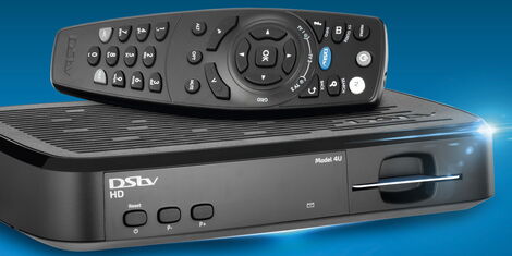 A photo of a DSTV decoder with its remote control